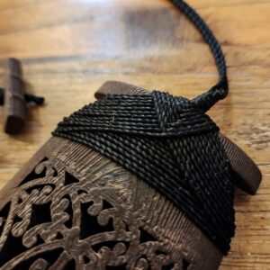 Black binding on sandalwood toki necklace