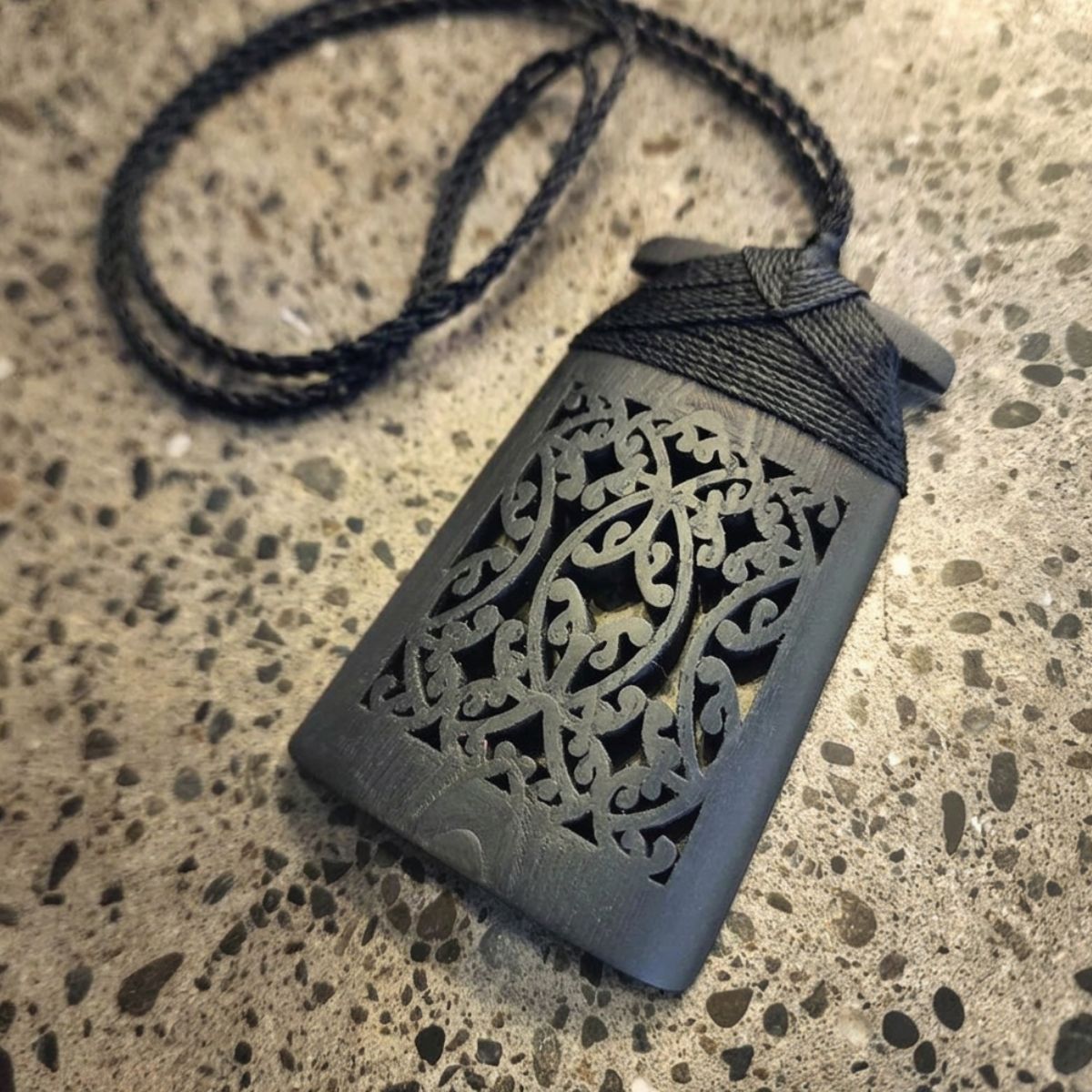 black ebony wood toki pendant with black binding and cord
