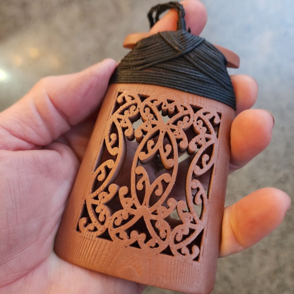 Copper Toki Pendant 3D printed with traditional maori binding in black waxed cord front view