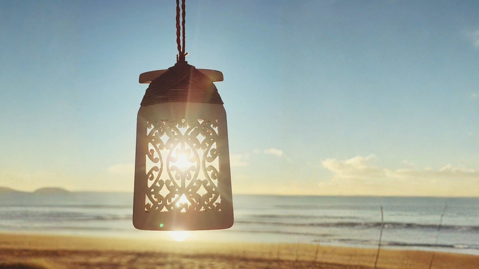 Dawn light shining through the mangōpare design of the toki necklace