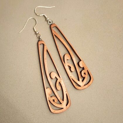 Closeup of the copper mangōpare toki earrings