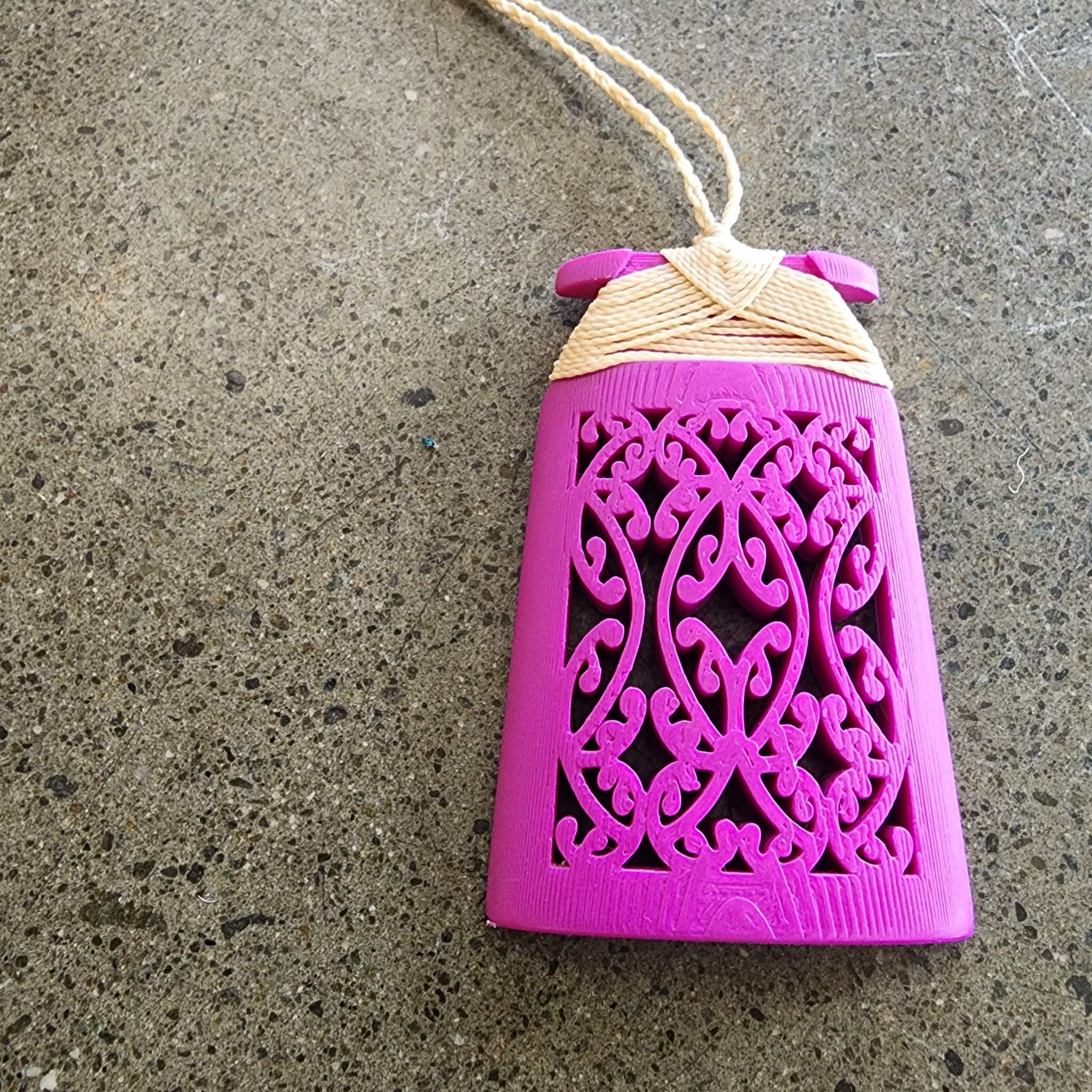 magenta toki with cream binding on concrete surface