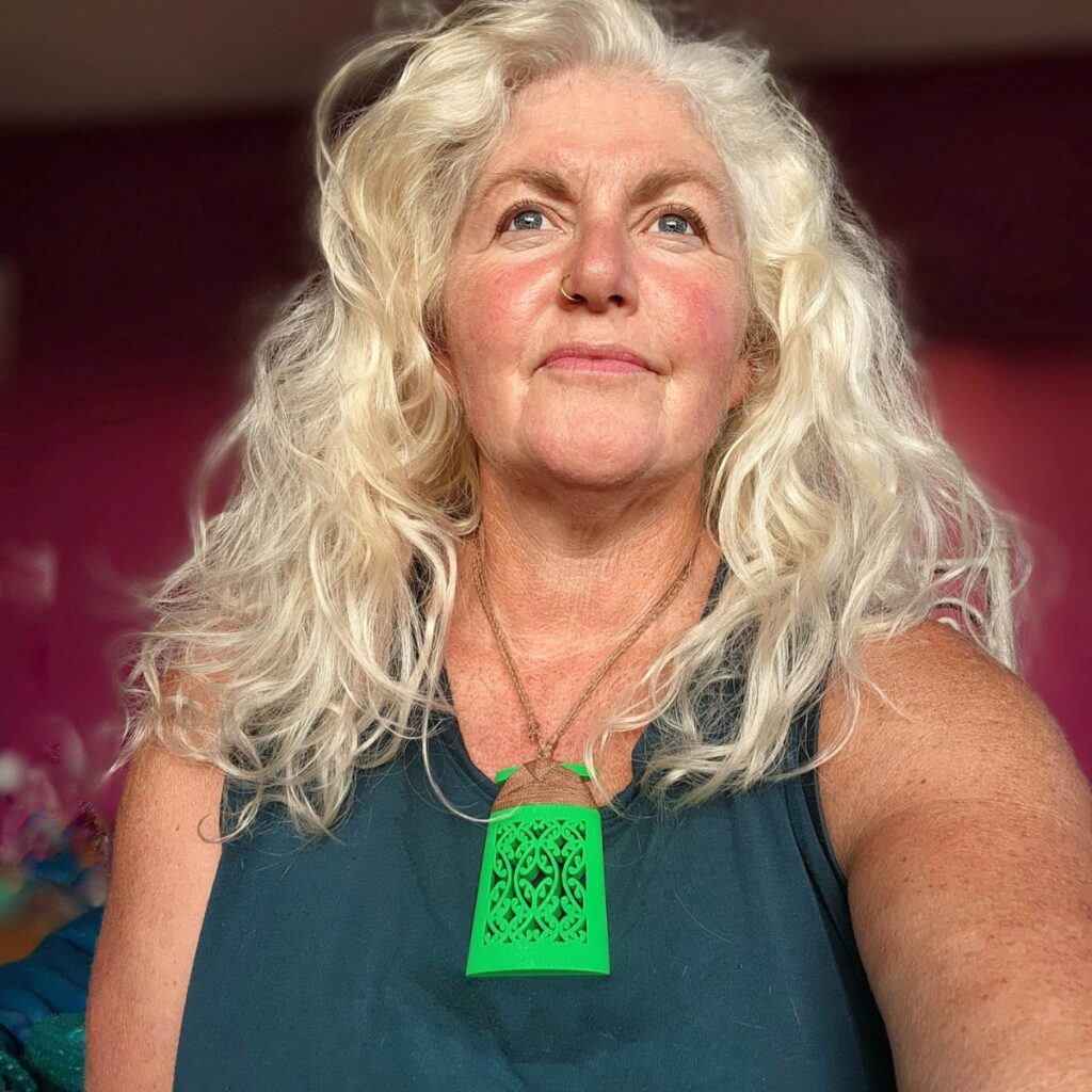 Sonia wearing a green mangōpare toki necklace
