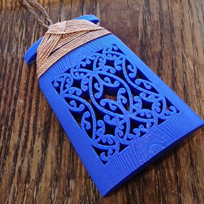 blue toki necklace sitting on a wooden background