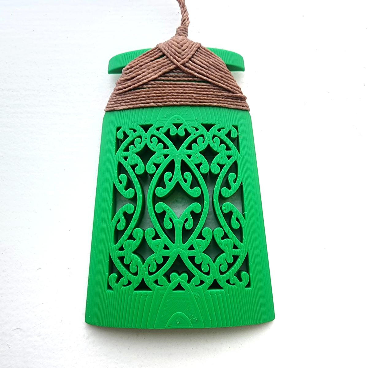 green toki necklace with brown binding front image on white background