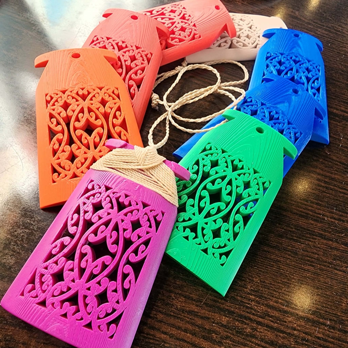 a collection of mangōpare toki necklaces in summer 2026 colours